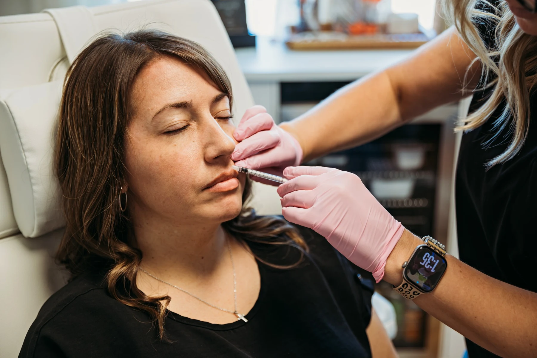 Cassie providing a lip injectable treatment at The Aesthetics Barn