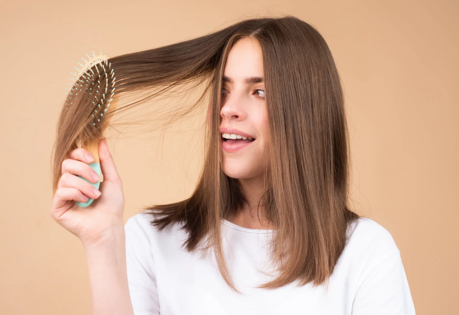 Woman caring for healthy looking hair